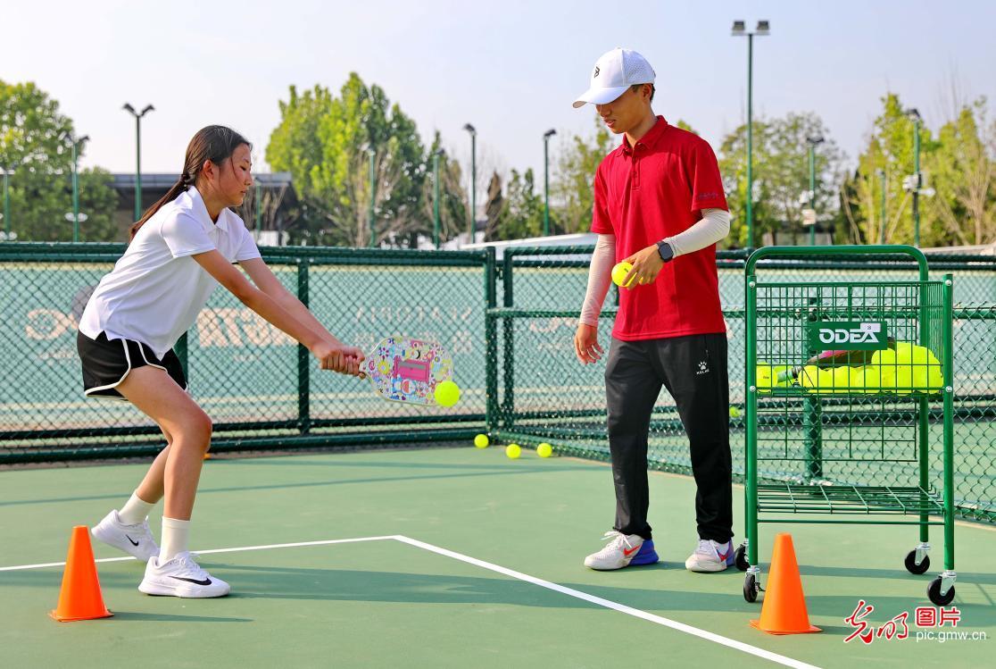 Children play pickleball during summer break