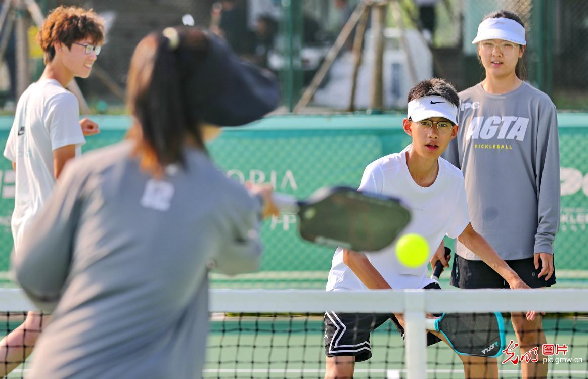 Children play pickleball during summer break