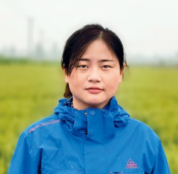 Young Woman's Dreams Blossom on Field of Hope